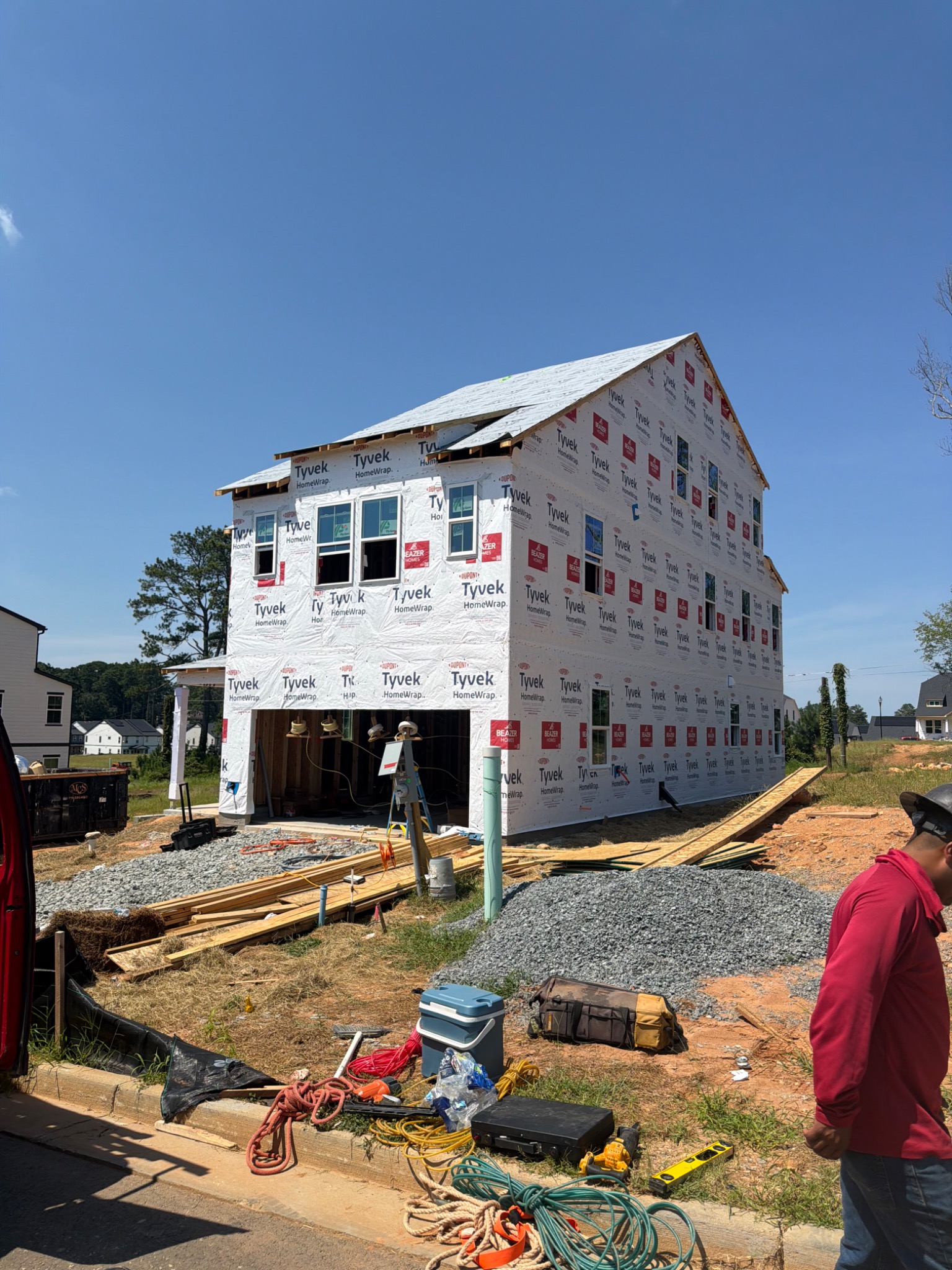 Two-story home wrapped with windows installed